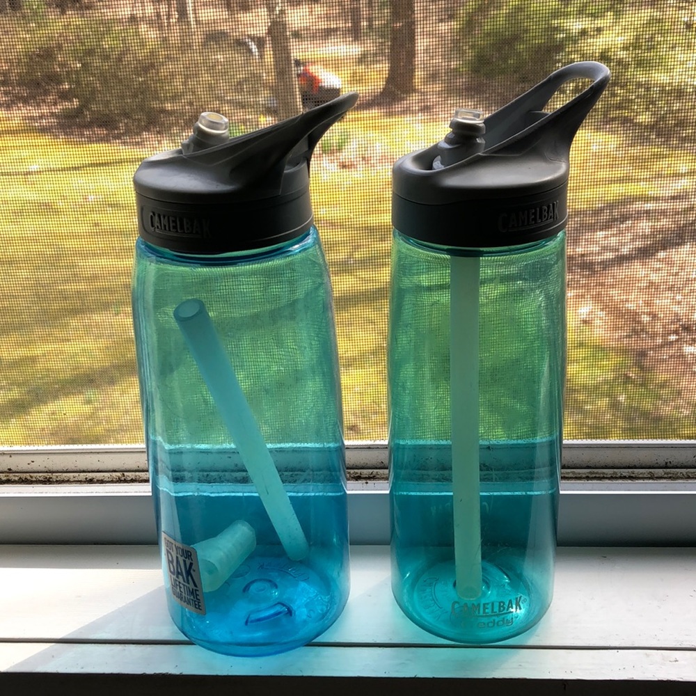 Two turquoise camelbak water bottles